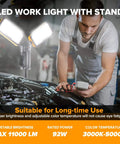 Mechanic using Ultra Bright LED Work Light With Telescoping Tripod, Beast Mode Brightness, Dual Head Design, 11000 Lumen, 92W Dimmable