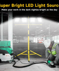 Ultra Bright Plug In LED Work Light With Stand 28,000 Lumen 110V Outdoor Flood Light With 4 Adjustable Heads in use at job site