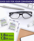 Individually Wrapped Lens Wipes For Glasses And Devices Streak Free Clarity next to glasses, pen, keyboard, and coffee cup.