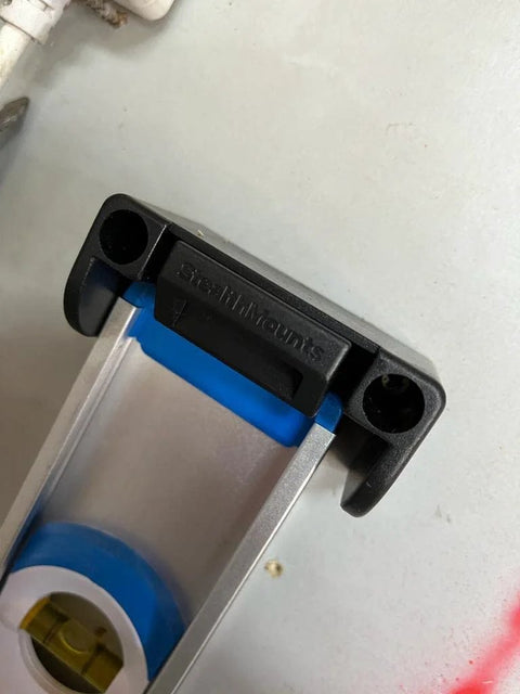 Universal level holder with locking mounts for secure and easy mounting on level surface, compatible with StealthMounts.