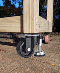 2 Inch Leveling Plate Caster Wheels With Adjustable Anti Vibration Leveling Feet on wood frame on outdoor concrete surface