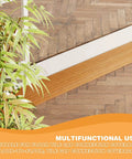 Floor Transition Strip 3.3ft, Double Sided Self-Adhesive PVC Floor Transition Strip installed on wood tile floor, doorway threshold ramp, light brown.