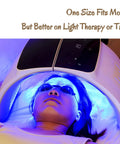 Person wearing see through safety goggles under tanning light device with 'One Size Fits Most' text.