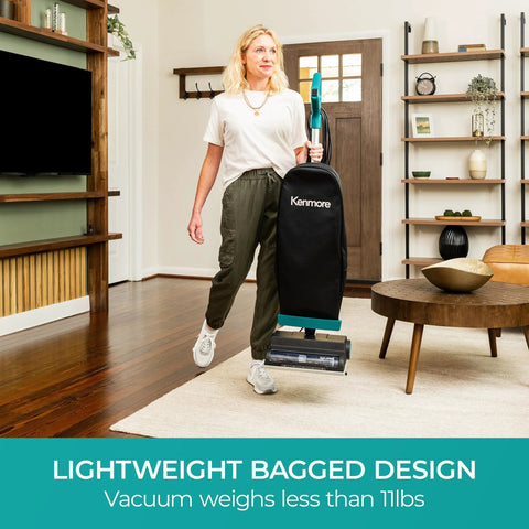Woman holding Powerful Commercial Upright Vacuum Cleaner With 14 Liter Bagged Capacity, LED Headlight, lightweight design