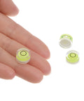 Close-up of Three Piece Round Bubble Level Set 12x6mm Mini Circular Bullseye Spirit Levels for leveling camera tripod telescopes.