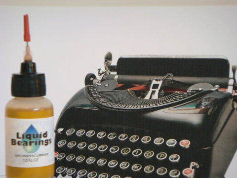 Liquid Bearings, SUPERIOR 100%-synthetic oil for lubrication of drones, RC vehicles and equipment, bottle next to typewriter
