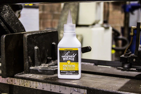 LIQUID WRENCH PENETRATING OIL 4 OZ DROPPER on a metal industrial machine