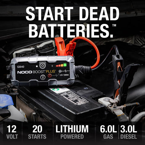 1000 Amp UltraSafe Jump Starter 12V Lithium Battery Booster Pack connected to car battery in engine compartment