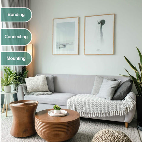 Living room with gray sofa, two wooden tables, decorative pillows, and green plants, highlighting bonding, connecting, mounting.