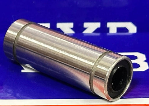 Close-up of 8mm Bearing/Bushing LM8LUU Linear Motion with resin retainer on blue background.