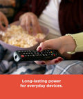 Couple watching TV with remote powered by Mixed Alkaline Battery Pack 12 AA 12 AAA With Reusable Plastic Case
