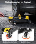 Low Profile Floor Jack 2 Ton With Stands By VEVOR shown lifting a car on asphalt, highlighting directional wheels and 360-degree casters.