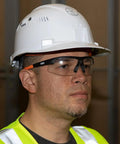 Man wearing Low Profile Safety Glasses Narrow Lens Z87 1 Anti Fog Scratch Resistant 2 Pack, in safety gear.