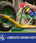 Hand using lubricant on wheel axle of 1-Pack Utility Cart Built for Moving Boxes, Appliances, and Heavy Cargo at Home, Warehouse, and Delivery Jobs.