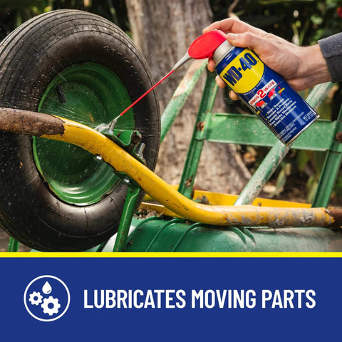Hand using lubricant on wheel axle of 1-Pack Utility Cart Built for Moving Boxes, Appliances, and Heavy Cargo at Home, Warehouse, and Delivery Jobs.