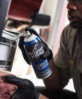 Person applying Heavy Duty Lubricating Oil For Tools And Machinery 11 Oz Keeps Moving Parts Slick Quiet And Rust Free from Liquid Wrench.