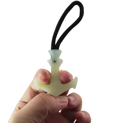 Person holding luminous TPU zip puller from 8 Piece Luminous Tail Cord Zip Puller Set For Outdoor Backpacks 42x44mm Heavy Duty TPU Extenders