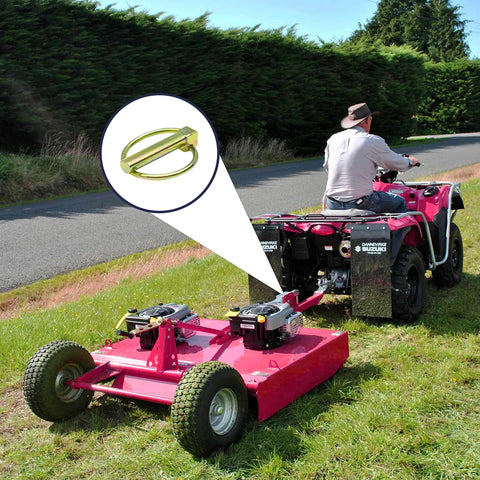 Heavy Duty Lynch Pin Assortment Kit 30-Piece Set securing a tow hitch on a lawn mower trailer