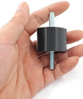 Hand holding one of four Pcs M10 Rubber Shock Absorber Anti Vibration Isolator Mounts For Diesel Engines Harvester And Generator Durable Noise Dampening Heavy Duty Engine Mounts For Smooth Operation