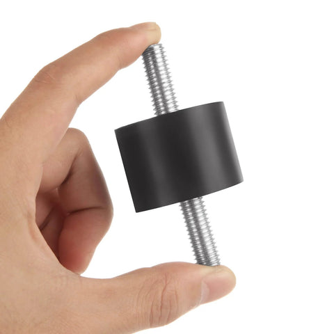Hand holding an Eight M10 rubber isolator mount with double studs, featuring a 40x30mm cylindrical design for vibration damping.