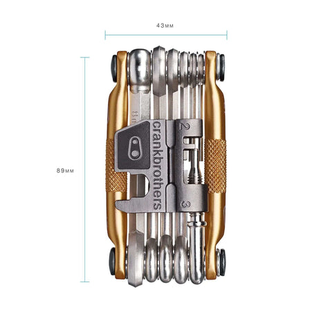M17 Gold Bicycle Multi Tool with various wrenches and chain tool, compact and ergonomic design, 89mm length, top view
