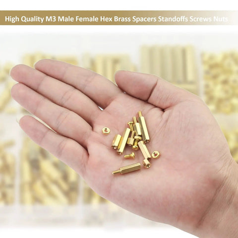 Close-up of hand holding small brass standoffs and nuts from 220 Piece M3 Brass Standoffs Kit With Screws And Nuts, assortment of spacers for PCBs