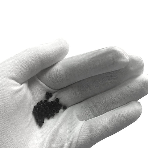 Gloved hand holding M3x3mm Metric Carbon Steel Hex Socket Set Flat Point Grub Screws Black for Towel Rack Door Knob 50pcs