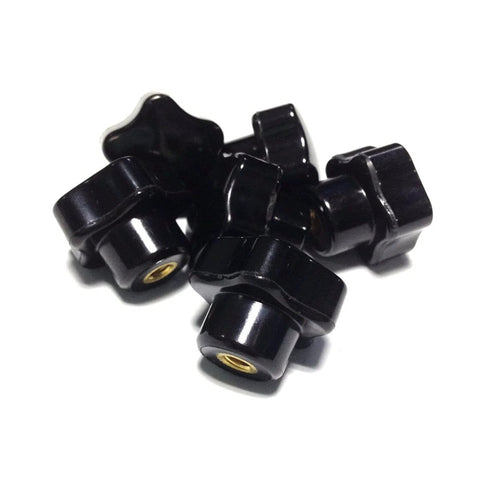 Six Pieces M5 x 25 Female Thread Star Knob Nuts With Clamping Grip, Flat Bottom, Plastic Black Cap, shown in a pile.