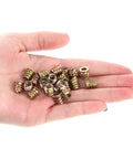 Hand holding 20 Pack M5x10mm Threaded Wood Inserts With Hex Drive Carbon Steel Furniture Nuts for Built to Last Joints