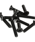 Black M6 x 20mm flat head socket cap screws set, alloy steel grade 10.9, with hex drive, DIN 7991 for precise assemblies, 25 pieces shown.