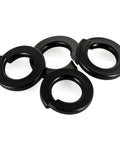 Four M6 Black Spring Lock Washer 304 Stainless Steel With Black Coating, shown in a close-up view