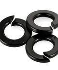Three M6 Black Spring Lock Washer 304 Stainless Steel With Black Coating shown stacked.