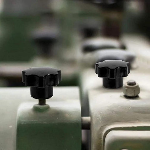 Five Pack M6 Internal Thread Clamping Knobs With 32mm Star Head Through Hole 7 Lobes Grip Black, installed on machinery