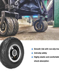 6x2 Inch Pneumatic Tire Wheel with Alloy Hub M8 Inflatable Air Wheel for Scooter Trolley Cart Hand Truck shown on urban street.