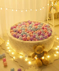 Ball Pit Balls - 100pcs - Crush Proof Plastic Children's Toy Balls Macaron Ocean Balls in a round play area with teddy bear