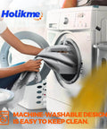 Person loading Holikme branded fabric into washing machine emphasizing machine-washable design.