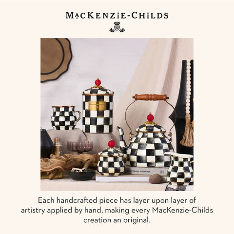 Mackenzie-Childs ceramic kitchenware set with black and white courtly check pattern, teapot, cups, and canisters on a table