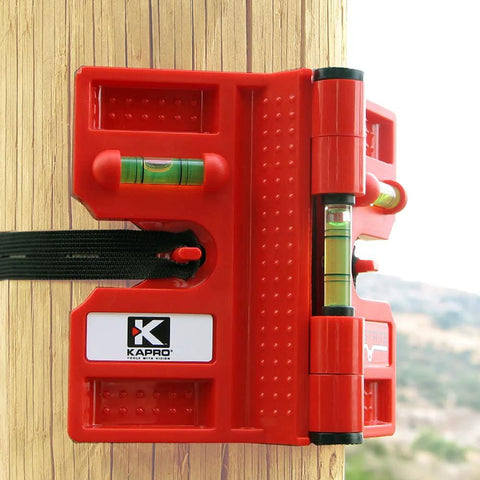 Effortlessly align posts and pipes with the 340 Postrite adjustable folding post level attached to a wooden post.
