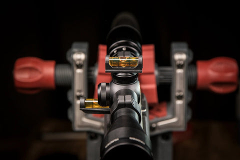 Close-up view of Magnetic Base Scope Leveling Tool for Gunsmithing and Maintenance by Wheeler Engineering mounted on a rifle scope.