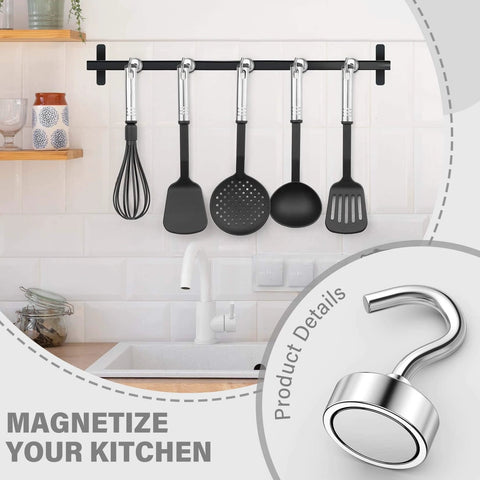 Magnetic kitchen hooks holding utensils above a sink with focus on a stainless steel hook.