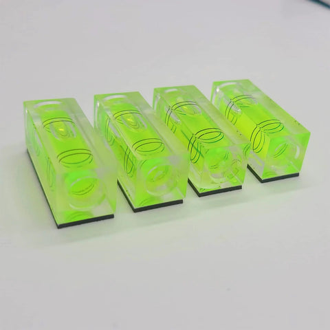 Magnetic Mini Bubble Level Tool Pack, Pocket Size, Ultra Precise 3Line Grid, 4 Pack shown aligned on surface.