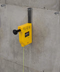 Magnetic plumb bob setter delivers fast, precise vertical alignment with a 14 oz bob, auto-recoil 14.5 ft line on concrete wall.