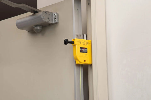 Magnetic plumb bob setter delivers fast, precise vertical alignment with a 14 oz bob, auto-recoil 14.5 ft line on door surface.