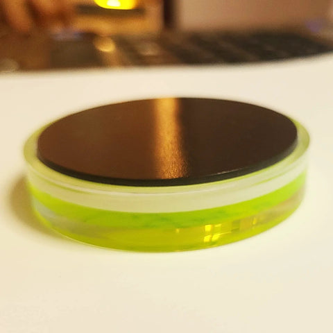 Side view of Magnetic Round Bubble Level Tool Pro Grade Bullseye Inclinometer, 60mm with acrylic housing and magnetic back.