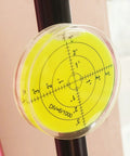 Magnetic Round Bubble Level Tool Pro Grade Bullseye Inclinometer for Machinists and DIY Enthusiasts attached to a metal rod.