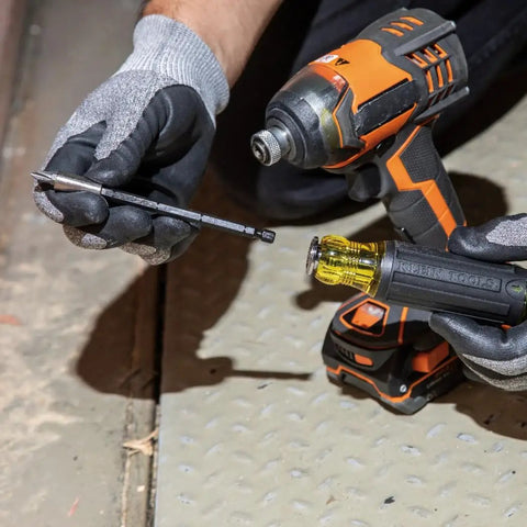 Person holding All-In-One Magnetic 14-In-1 Screwdriver Set With 13 Bits And One Quarter Inch Nut Driver, impact-rated blade removed for use.