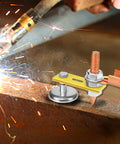 Fix Tite Magnetic Welding Ground Clamp with strong suction head and copper tail stabilizer in use on metal surface during welding.