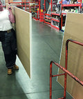 Worker carrying plywood using the JawClaw Panel Gripper for Plywood, Drywall and Steel Sheets, ensuring smooth motion and alignment.
