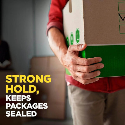Person holding a box sealed with Scotch Sure Start Packing Tape 1.88in x 54.6yd Clear for Shipping and Mailing, Durable Hold, Smooth Unwind.