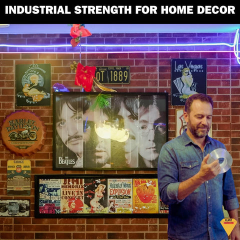 Person holding Ultra Strong Clear Double Sided Tape With Enhanced Nano Technology Waterproof Mounting Adhesive in decorated room